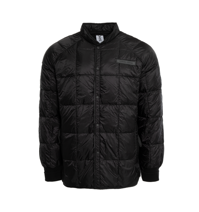 Image 1 of 3 - BLACK - CANADA GOOSE Hexode Jacket featuring power Stretch cuffs enhance fit and add comfort, hem is longer in the back for added coverage and protection, 2 exterior pockets and snap button closure. 100% nylon. 