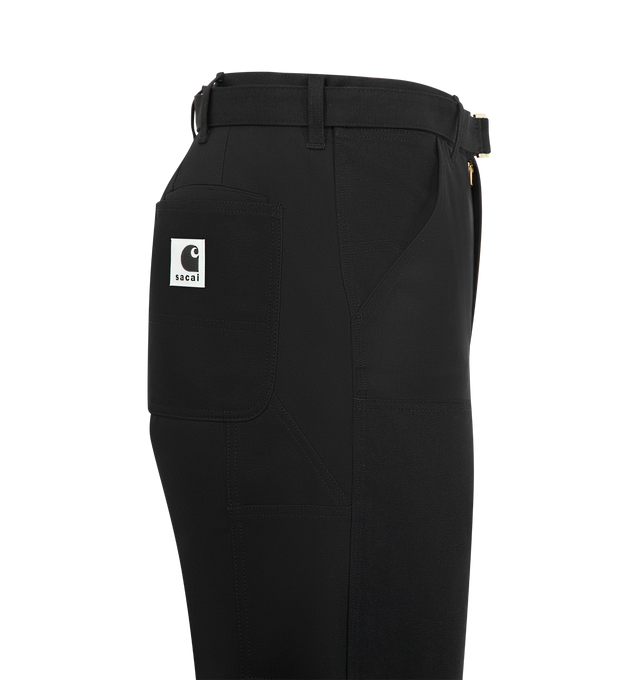 Image 3 of 3 - BLACK - SACAI X CARHARTT Duck Pants featuring a cargo-inspired silhouette with double-knee various patch pockets, a woven belt, side and back patch pockets and zip fly, button closure. 100% cotton. Made in Japan.
