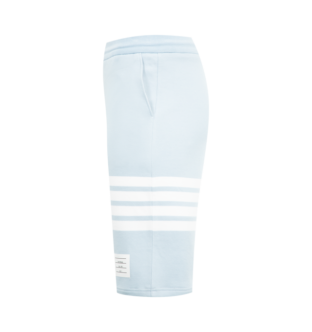 Image 3 of 3 - BLUE - THOM BROWNE Classic Loopback 4-Bar Sweatshorts featuring drawstring waistband with silver tone aglets, engineered 4-bar stripe detail at left thigh, name tag applique above left cuff, slip side pockets, single back welt pocket and signature striped grosgrain loop tab at back waist. 100% cotton. Made in Japan.