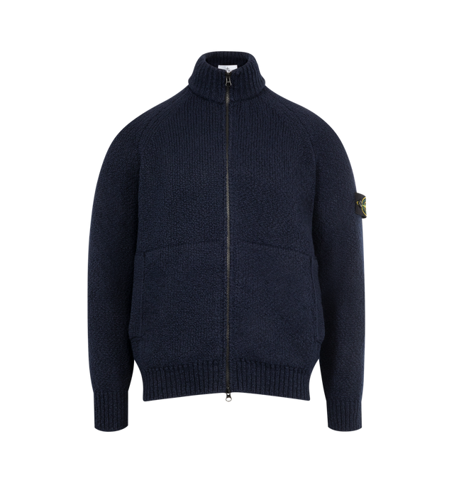 Image 1 of 3 - NAVY - STONE ISLAND Wool Cardigan featuring knit virgin wool-blend, rib-knit stand collar, hem, and cuffs, two-way zip closure, patch pockets at waist, raglan sleeves and detachable felted logo patch at sleeve. 48% virgin wool, 43% polyamide, 9% viscose.