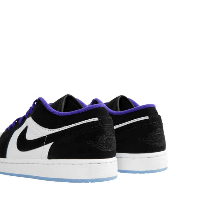 Image 3 of 5 - BLACK - Air Jordan 1 Low Men's Shoes are inspired by the iconic 1985 original and feature a low-top silhouette with timeless basketball heritage styling. Designed with a clean, versatile profile, this classic sneaker pairs easily with any wardrobe while delivering the unmistakable look that made the AJ1 a cultural icon. Main Material: Leather Upper. Closure: Lace-Up. Details: Air Jordan 1 Low Silhouette, Signature Wings Branding, Perforated Toe Box, Classic Cupsole Construction. Color: White/