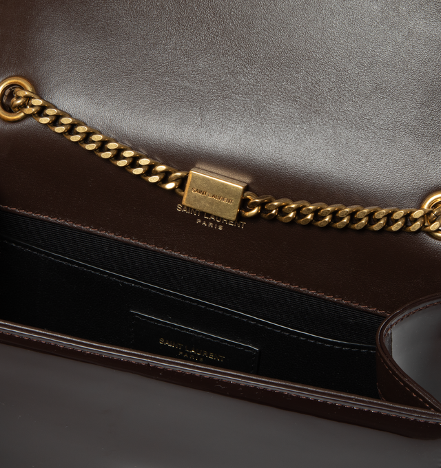 Image 3 of 3 - BROWN - SAINT LAURENT Kate Small Bag in Patent Leather featuring curb chain, grosgrain lining, magnetic fastening and interior slit pocket. 4.9"H x 7.8"W x 2"D. Strap drop: 56cm. 90% calfskin leather, 10% metal. Made in Italy. 