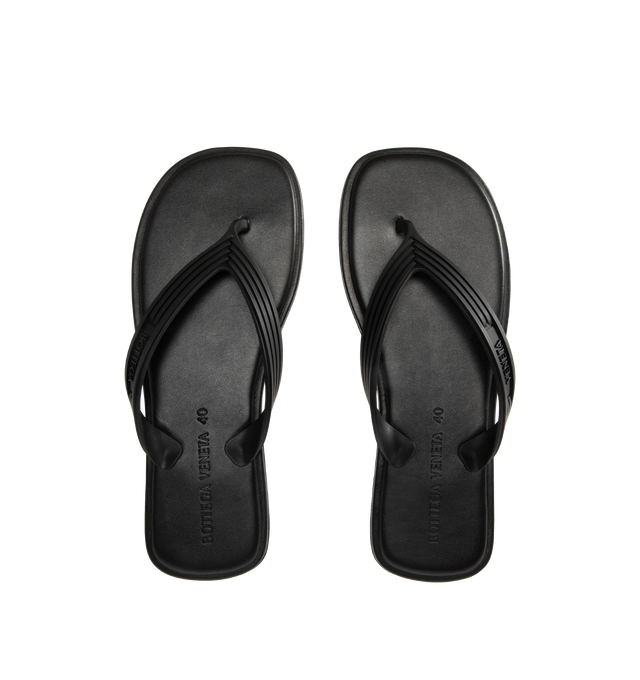 Image 4 of 4 - BLACK - BOTTEGA VENETA Sampieri Thong featuring rubber thong sandal with leather insole. Lining: lambskin. Rubber-injected leather outsole. Thermoplastic polyurethane. Made in Italy.