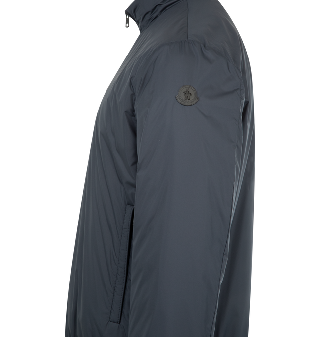 Image 3 of 3 - BLUE - MONCLER Berre Short Down Jacket featuring water-repellent main fabric, AirSoft lining, down-filled, zipper closure, zipped pockets, inner pocket with snap button closure and leather logo patch. 100% polyester.