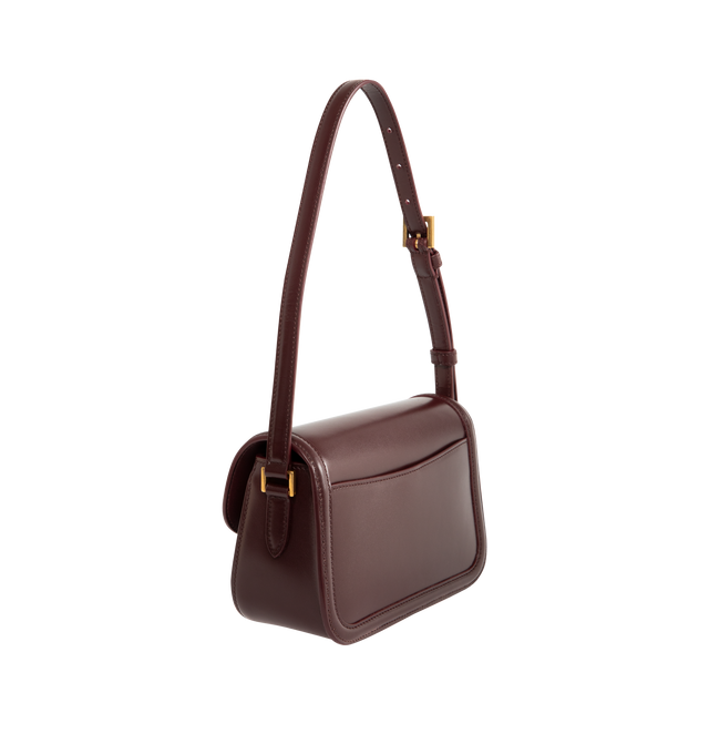 Image 2 of 3 - RED - SAINT LAURENT Solferino Mini Bag featuring box leather with a CASSANDRE closure, fully lined in leather, rounded lines, an adjustable strap for shoulder wear and bronze-tone hardware. 7.5" x 4.7" x 3". Calfskin. Made in Italy.