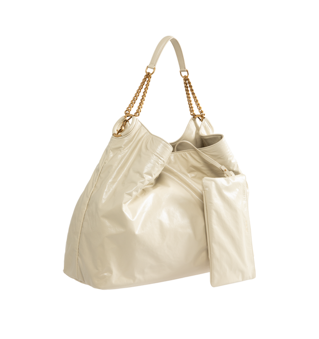 Image 2 of 4 - NEUTRAL - Saint Laurent Womens Hobo Bag is crafted from lustrous calfskin leather. Features a slouchy silhouette, signature Cassandre ring detail, shoulder strap, magnetic closure, removable zip pouch, suede lining, and bronze-tone hardware. Main Material: Calfskin Leather; Lining: Suede; Hardware: Brass. Made in Italy.