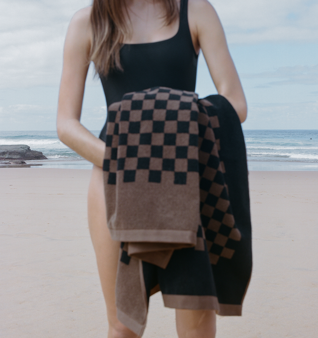 Image 3 of 6 - BROWN - BAINA x 1910 Heritage Beach Towel Set includes 4 Beach Towels (35 x 67 inches). 100% Organic Cotton. Referencing the legacy of Hirshleifers with deep tones of Tabac & Noir, giving a feeling of retro luxe, evoking a destination off the Italian coast, circa 1972. Generous in size and luxuriously soft, they create an enveloping embrace.  