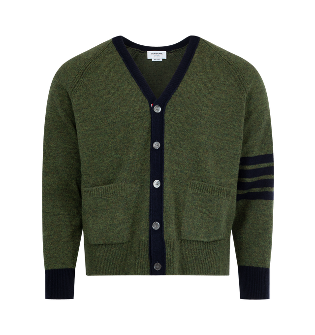Image 1 of 2 - GREEN - THOM BROWNE Shetland Wool Cardigan featuring front button closure with striped grosgrain placket, 2 front slip pockets, 4-bar detailing, v neck, relaxed fit, contrast trim and cuffs and signature striped grosgrain loop tab. 100% wool. Made in Italy.