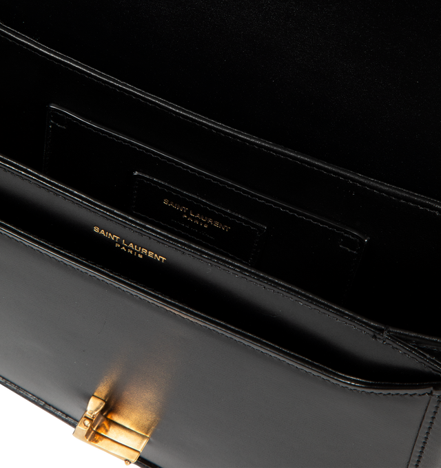Image 3 of 3 - BLACK - SAINT LAURENT medium leather satchel with flap featuring push-lock closure, 2 inner pockets, adjustable shoulder strap and metal logo hardware. Measures 9 X 6.2 X 2.3 inches with 15.3 inch drop strap.  Made in Italy.
