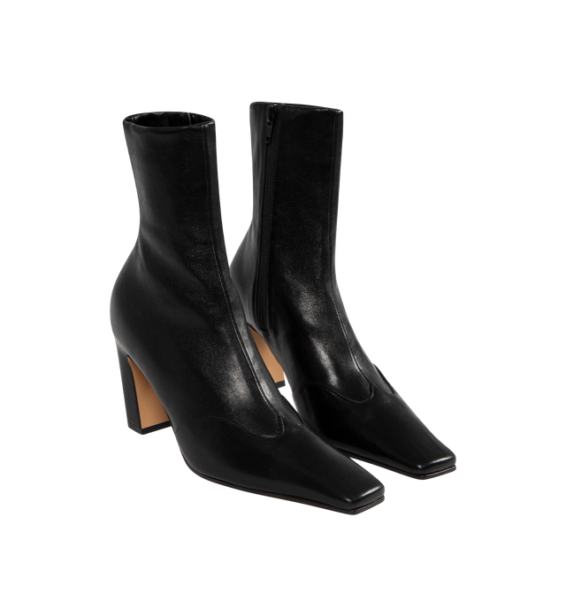 Image 2 of 4 - BLACK - KHAITE Nevada Stretch High Boot featuring a mid-calf urban cowboy boot with a squared toe, a stylized wingtip traced by tonal topstitching and a side zipper closure. Heel Height: 3.4 in. 100% lambskin. Made in Italy.