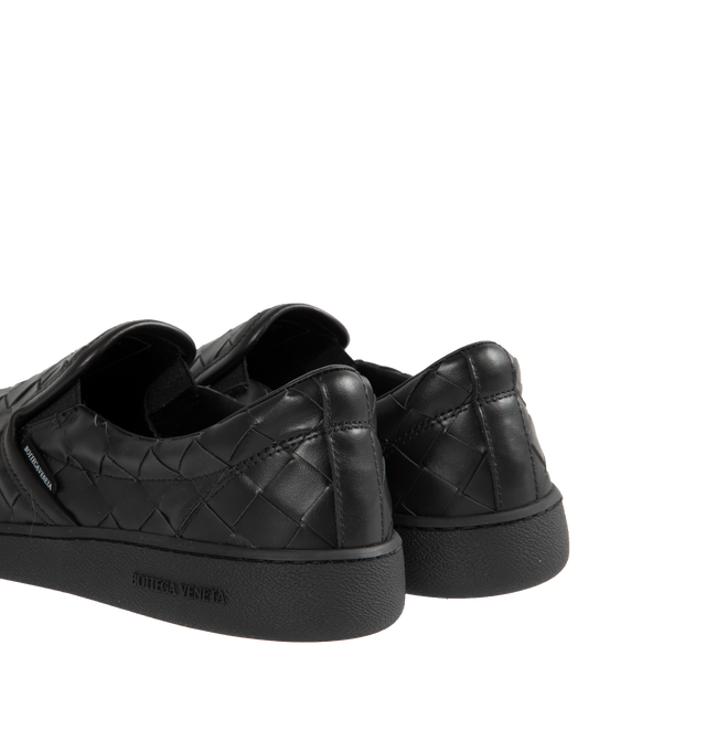 Image 3 of 5 - BLACK - BOTTEGA VENETA Sawyer Slip-On Sneakers featuring padded collar, elasticized gusset at sides, logo flag at outer side, logo printed at padded footbed, logo embossed at textured rubber midsole and treaded rubber sole. Upper: leather. Sole: rubber. Made in Italy. 