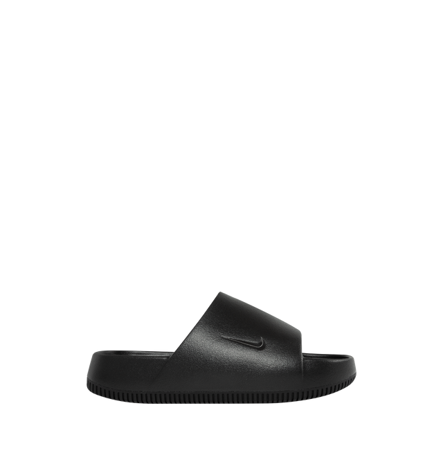 Image 1 of 5 - BLACK - NIKE Calm minimalist slides with debossed Nike Swoosh logo. Contoured foam composition is super soft with a responsive feel. The textured footed is for the stay-put foot placement. This shoe has a full-length rubber outsole for guaranteed grip on all surfaces with quick-drying design. 