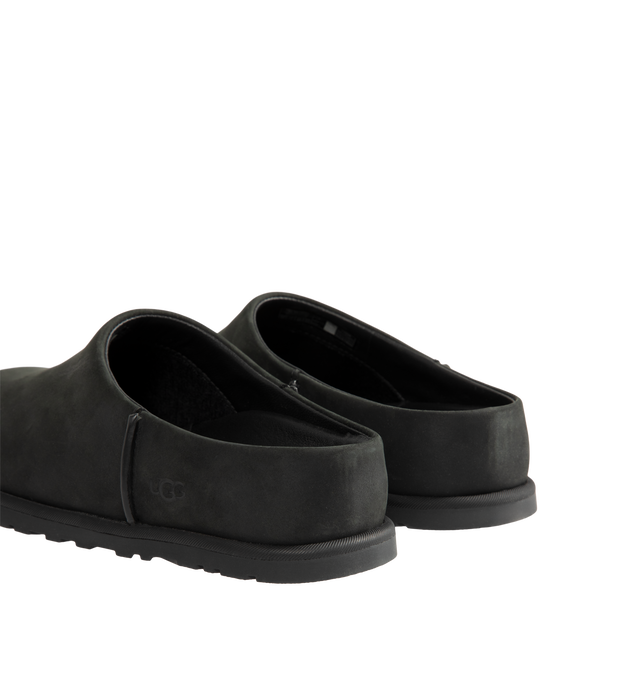 Image 3 of 4 - BLACK - UGG women's Otzo Clog built with a luxe nubuck upper, thoughtful knit + leather lining, and a contoured footbed for steady movement. This clog has easy slip-on style with all-day comfort. Waterproof leather, nubuck upper, leather and wool jersey lining with peppermint-based anti-odor treatment. Contoured EVA footbed, lightweight rubber outsolewith embossed UGG logo.