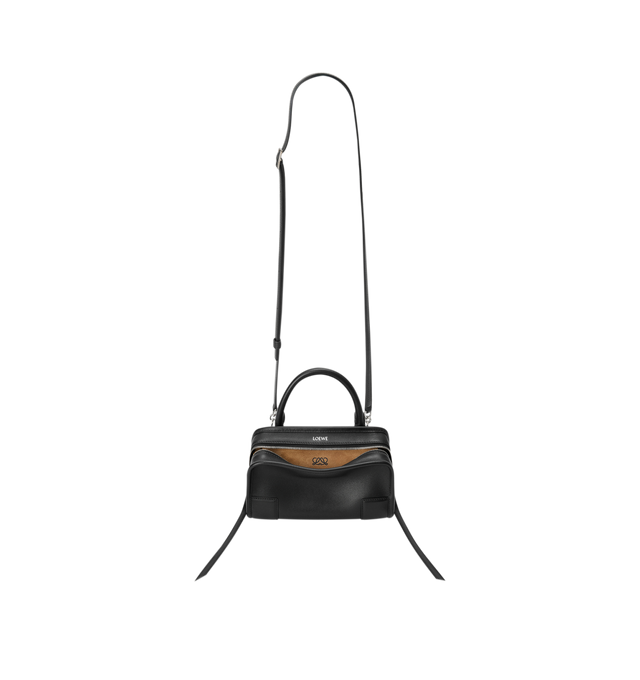 Image 6 of 11 - BLACK - Loewe Mini Amazona 180 Bag in leather features a relaxed silhouette anchored by a single toron top handle, designed to be carried open, while a concealed closure secures the main compartment, removable shoulder and crossbody straps, two carry options: short handle, removable and adjustable crossbody strap, zip closure with two leather zip pullers, two compartments, main compartment closed with magnetic closure, left side d-ring for customization, suede and nappa lambskin lining, and