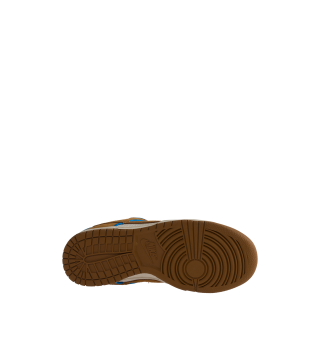 Image 4 of 5 - BROWN - NIKE Dunk Low Retro Premium in "British Tan" featuring padded, low-cut collar, aged upper, foam midsole and rubber outsole with classic hoops pivot circle. 