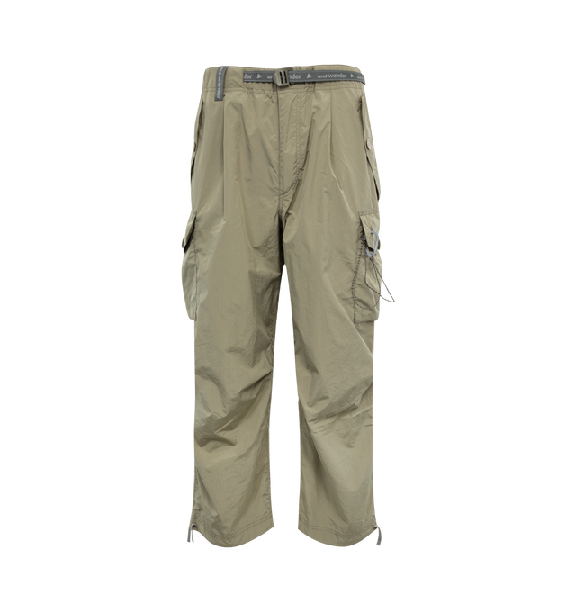 Image 1 of 3 - GREEN - AND WANDER 81 Oversized Cargo Pants featuring ripstop texture, straight leg, elasticated waistband, dart detailing, two side button-fastening pockets, two side cargo pockets, two rear button-fastening pockets, embroidered logo to the rear, tied cuffs and front button and zip fastening. 67% polyester, 33% nylon. 