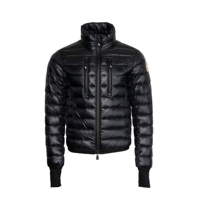 Image 1 of 2 - BLACK - MONCLER GRENOBLE Hers Puffer Jacket featuring signature stripe accents, stand colla, two-way zip closure, zip pockets at chest, long sleeves, logo patch at sleeve and thumbhole cuffs. Polyamide/elastane. Lining: nylon/polyester. Fill: down/feather. Made in Romania. 