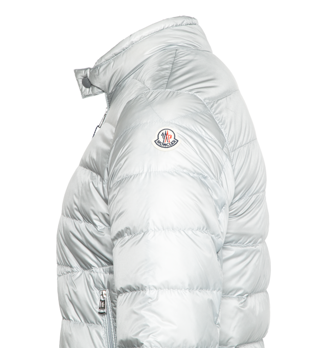 Image 3 of 3 - SILVER - MONCLER Acorus Short Down Jacket featuring down-filled, packable, front zipper closure, zipped pockets, collar opening and adjustable cuffs with snap button closure and logo patch. Exterior: 100% polyamide/nylon. Lining: 100% polyamide/nylon. Padding: 90% down, 10% feather. Made in Italy.  