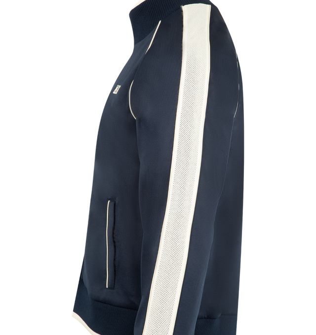 Image 3 of 3 - NAVY - WALES BONNER Motion Track Top featuring funnel collar, front zip closure, front pockets, embroidered WB at chest and contrast piping. 55% polyester, 45% cotton. Made in Portugal.