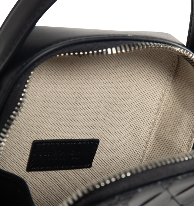 Image 3 of 3 - BLACK - BOTTEGA VENETA Getaway Phone Pouch featuring handle and adjustable cross-body strap, one main compartment, one flat inside pocket, leather gussets preventing items to fall from the sides and zip closure. Calfskin. Lining: canvas. 7.5 x 4.3" x 1.6. Made in Italy.