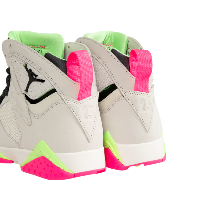 Image 3 of 5 - MULTI - Air Jordan 7 Retro "Tennis Day" Sneakers feature a Phantom upper with Lime Blast, Pink Blast, and Anthracite accents inspired by Nike's Challenge Court era. Leather, synthetic leather, suede, and breathable textiles combine throughout the mid-cut design, while a heel pull tab, foam midsole with full-length Nike Air cushioning, and grippy rubber outsole complete the construction. Upper: Leather, Synthetic Leather, Suede, and Textile. Midsole: Foam. Sole: Rubber. Made in mens sizing.