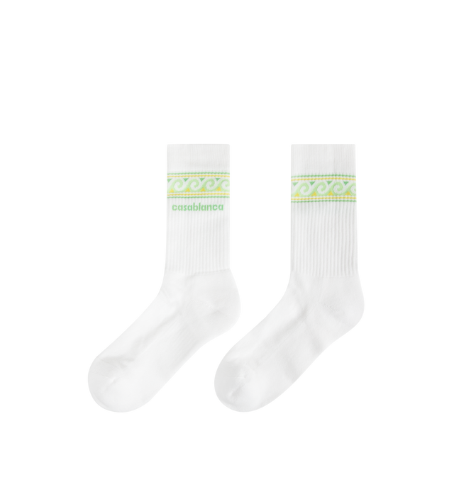 Image 2 of 2 - WHITE - CASABLANCA Knitted Wave Sport Socks featuring a wave border in green and yellow colourway, premium knit construction, ribbed cuffs and reinforced heel and toe construction. 85% recycled cotton 14% polyamide 1% elastane. Made in Portugal.
