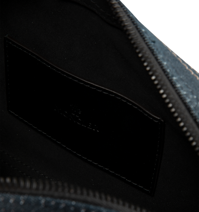 Image 3 of 3 - BLUE - Moncler Men's Carlo Denim Crossbody Bag is crafted from cotton-blend denim and features a spacious silhouette with an interior leather pocket for everyday organization. Designed with an adjustable shoulder strap, this designer crossbody bag is finished with leather trim, a micro-suede lining, an exterior snap-button pocket, an embossed logo base, and metal Moncler logo detailing. Exterior: 75% Cotton, 24% Polyester, 1% Elastane/Spandex. Lining: 100% Polyamide/Nylon. Leather Inserts: Co