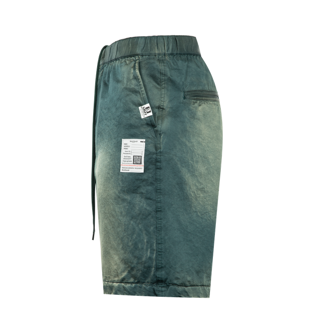 Image 3 of 3 - GREEN - Maison Mihara Yasuhiro Men's Sun Faded Satin Shorts are crafted from satin and feature a relaxed silhouette with a sun-faded finish for a vintage-inspired look. These designer shorts combine lightweight comfort with Maison Mihara Yasuhiro's signature contemporary aesthetic, creating an effortless style for everyday wear. Main Material: Satin. Made in Japan.