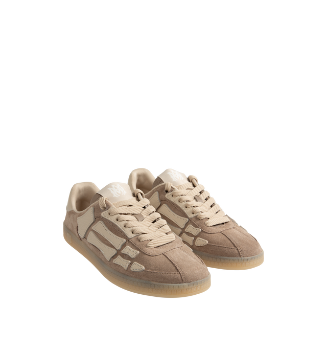 Image 2 of 5 - BROWN - Amiri Pacific Bones Sneakers are a lace-up style with leather bone appliques and rubber soles. Leather and rubber. Made in China.