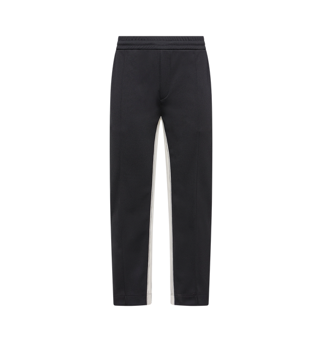 Image 1 of 2 - BLACK - MONCLER Sweatpants featuring elastic waist, side pockets, back welt pocket and logo patch. 100% polyester.