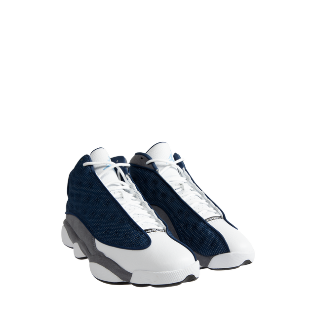 Image 2 of 5 - BLUE - Men's Jordan 13 "Flint 2020" Sneakers feature a premium leather upper with Flint Grey nubuck overlays, French Blue reflective ballistic mesh panels, and the signature holographic emblem for an iconic heritage design. These lifestyle sneakers combine responsive cushioning, a supportive midsole, and a durable rubber outsole for lasting comfort, stability, and everyday traction. Main Material: Leather, Nubuck, and Textile. Midsole: Cushioned Foam. Sole: Rubber.
