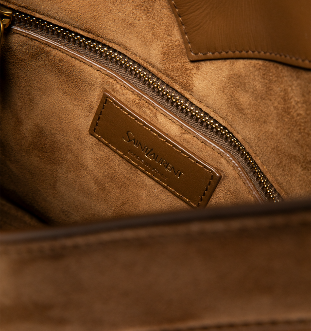 Image 3 of 3 - BROWN - SAINT LAURENT Y Bucket Top Handle Bag featuring suede exterior with leather lining, gold-tone hardware, open top, one main compartment, 1 interior zip pocket, adjustable removable shoulder strap and Y detail. 9.84" W x 8.66" H x 5.9" D. Made in Italy.