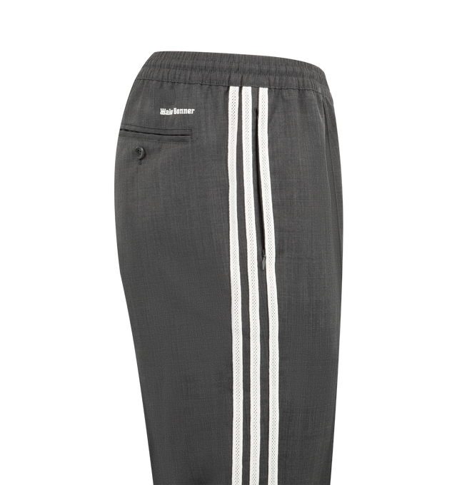 Image 4 of 4 - GREY - ADIDAS X WALES BONNER Wool Pant featuring tapered-leg track pants decorated with adidas' signature 3-Stripes on both sides, the Wales Bonner logo embroidered at the back, elasticized waistband, side slip pockets, back button-through welt pocket and pulls on. 50% wool, 50% polyester.