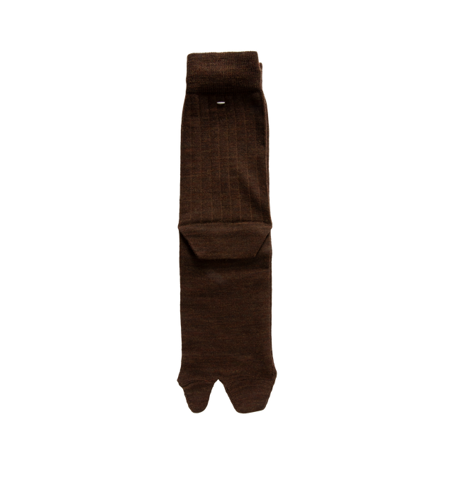 Image 1 of 2 - BROWN - Maison Margiela Tabi Socks are crafted from a wool-blend jersey and feature the Maison's iconic split-toe construction inspired by traditional Japanese tabi socks. Designed with ribbed cuffs, a mid-calf length silhouette, and the signature single white stitch at the back, these socks combine comfort with a distinctive archival design. Main Material: 78% Wool, 22% Polyamide. Made in Italy.