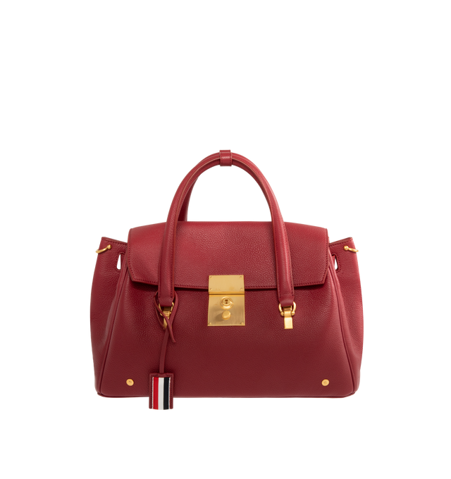 Image 1 of 4 - RED - THOM BROWNE Bolton Bag featuring padlock flap closure, top handles, key bell with RWB grosgrain trim, detachable adjustable leather shoulder strap, detachable RWB ribbon-woven chain strap, RWB stripe on front and back, adjustable side gussets with belt and stud details, interior zip pocket, slip pocket, and two smaller slip pockets, tricolor lining and signature striped grosgrain loop tab. L 33 x W 15 x H 35 cm. 100% calf full grain leather. Lining: 100% polyester. Made in Italy.