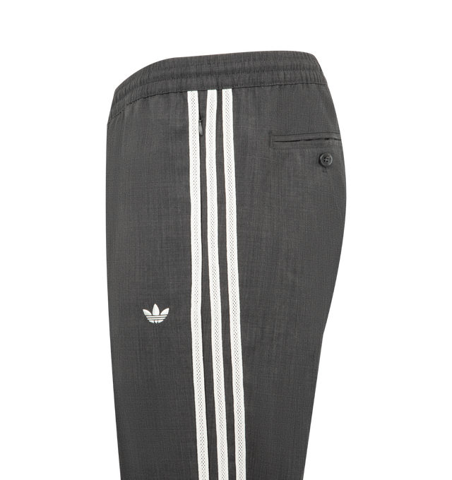 Image 3 of 4 - GREY - ADIDAS X WALES BONNER Wool Pant featuring tapered-leg track pants decorated with adidas' signature 3-Stripes on both sides, the Wales Bonner logo embroidered at the back, elasticized waistband, side slip pockets, back button-through welt pocket and pulls on. 50% wool, 50% polyester.