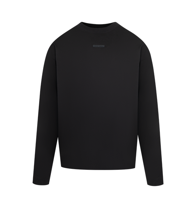 Image 1 of 2 - BLACK - FEAR OF GOD ESSENTIALS Classic Long Sleeve Tee made from medium-weight 100% cotton jersey featuring a classic fit with signature Fear of God relaxed proportions for everyday wear. Branding includes a Fear of God Essentials rubberized label at the center front and a new "Essentials Fear of God" beveled metallic logo across the back. 100% cotton.