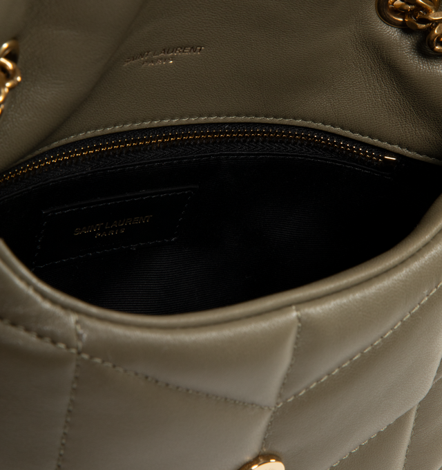 Image 4 of 4 - GREEN - SAINT LAURENT LouLou Puffer Toy Bag crafted from soft nappa lambskin with chevron quilting. Featuring magnetic snap tab, light bronze hardware, and a sliding 11.4 inch to 21.7 inch long chain strap suitable for use as a shoulder bag or cross-body. Interior features a zipped pocket, two card slots and grosgrain lining. Measures 9 X 6.1 X 3.3 inches. 100% lambskin. Made in Italy.