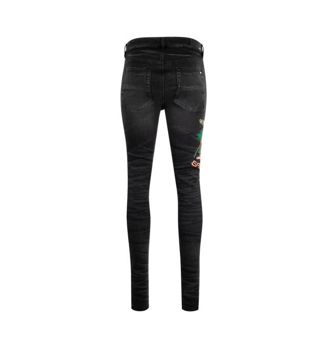 Image 2 of 3 - BLACK - AMIRI MA Cement Thrasher Skinny Jeans featuring stretch denim, fading, distressing and whiskering throughout, belt loops, five-pocket styling, button fly, embroidered graphic at outseams and skinny fit. 92% cotton, 6% elastomultiester, 2% elastane. Made in United States.