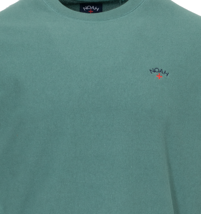 Image 2 of 3 - GREEN - NOAH Core Logo Pocket T-shirt featuring embroidered logo on chest, crew neck, long sleeves and ribbed cuffs, hem and collar. 100% cotton.  