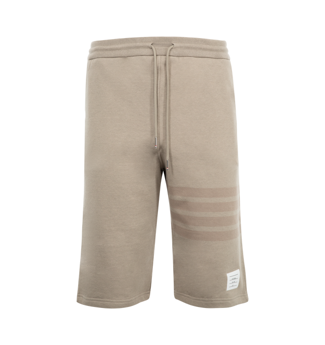 Image 1 of 3 - BROWN - THOM BROWNE Classic Loopback 4-Bar Sweatshorts featuring 4-Bar stripe detailing, drawstring waistband, engineered 4-bar stripe detail at left thigh, name tag applique above left cuff, slip side pockets, single back welt pocket and signature striped grosgrain loop tab at back waist. 100% cotton. Made in Japan.