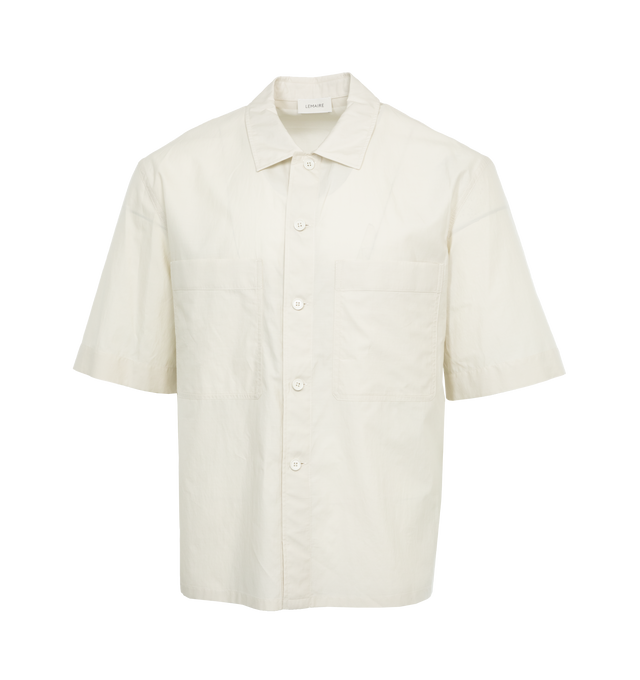Image 1 of 3 - WHITE - LEMAIRE Pyjama Shirt featuring relaxed fit, below-the-elbow sleeves, classic collar, mother-of-pearl buttons and two front patch pockets. 80% cotton, 20% silk. Made in Portugal. 