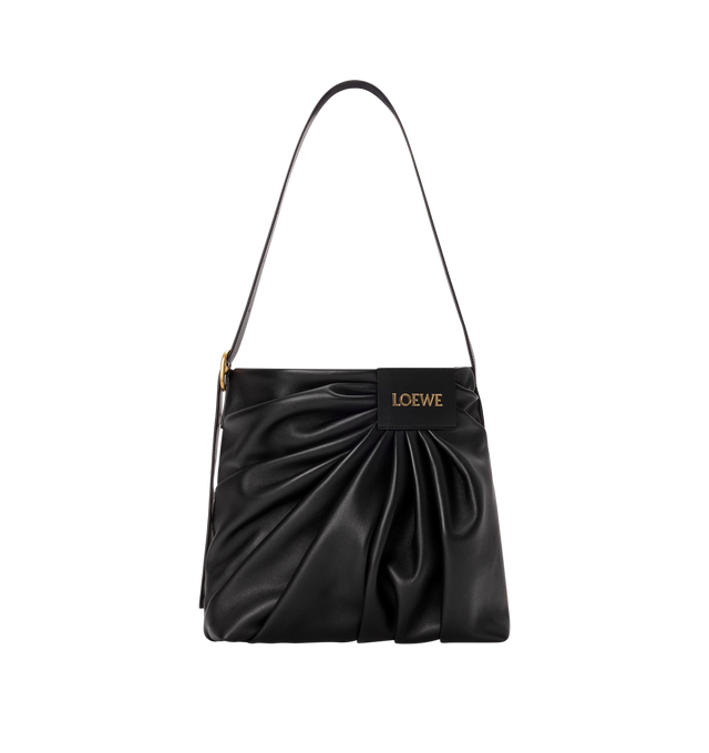 Image 1 of 4 - BLACK - LOEWE Draped Tote featuring soft scultpural shape and a wide strap adorned with a bold LOEWE-engraved buckle, shoulder or crossbody carry, adjustable strap, magnetic closure, one internal calfskin patch pocket, herringbone cotton canvas lining and gold embossed LOEWE. Mellow nappa lambskin. 30 cm x 29 cm x 13 cm. Made in Spain. This item may be restricted for online purchase to international clients. For assistance purchasing this item please contact our dedicated stylist team at pers