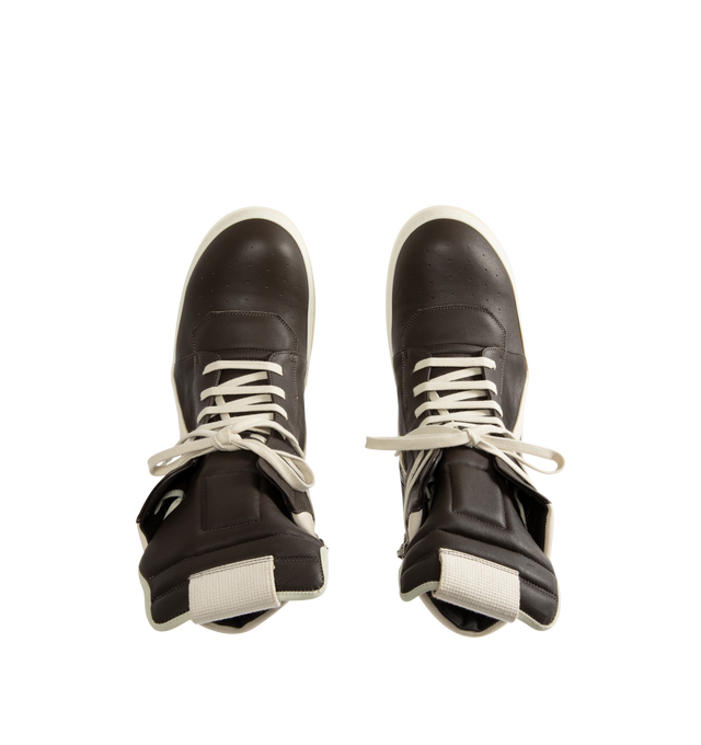 Image 5 of 5 - MULTI - Rick Owens Mens Geobasket High-Top Sneakers feature a full-grain cow leather upper. Designed with an above-ankle silhouette, extended tongue with webbing pull tab, signature geometric paneling, padded back counter, contrast laces, inner ankle zip closure, and shark-tooth thermoplastic rubber outsole. Upper: 100% Cow Leather; Lining: 100% Calf Leather; Insole: 100% Calf Leather; Outsole: 100% Thermoplastic Rubber. Sole Height: 3.5 cm. Made in Italy.