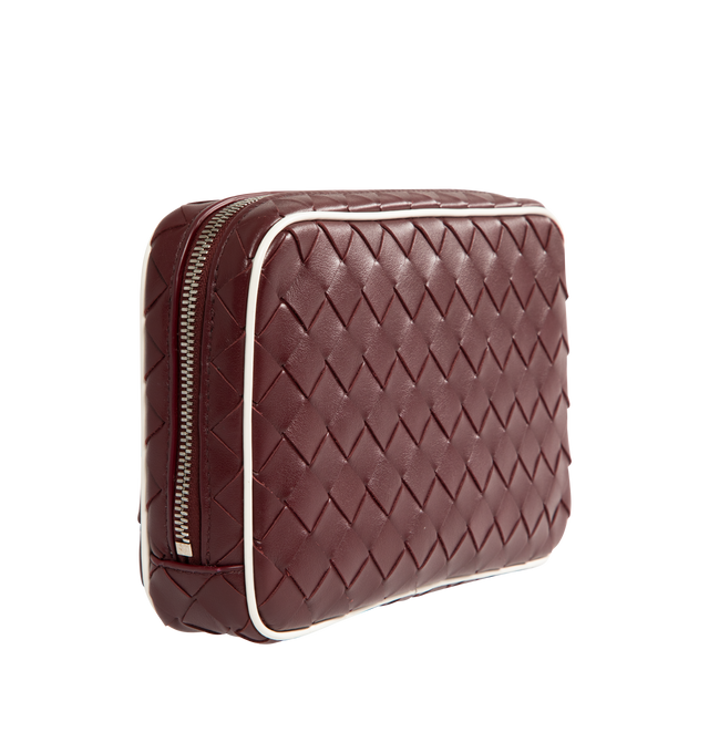 Image 3 of 4 - BROWN - Bottega Veneta medium zipped pouch in Intrecciato calf leather with contrasted piping, interior leather tag with embossed logo and zipper closure. Calfskin with canvas lining and silver tone hardware. Measures 6.7" high x 10.2" wide x 2" deep. Made in Italy.