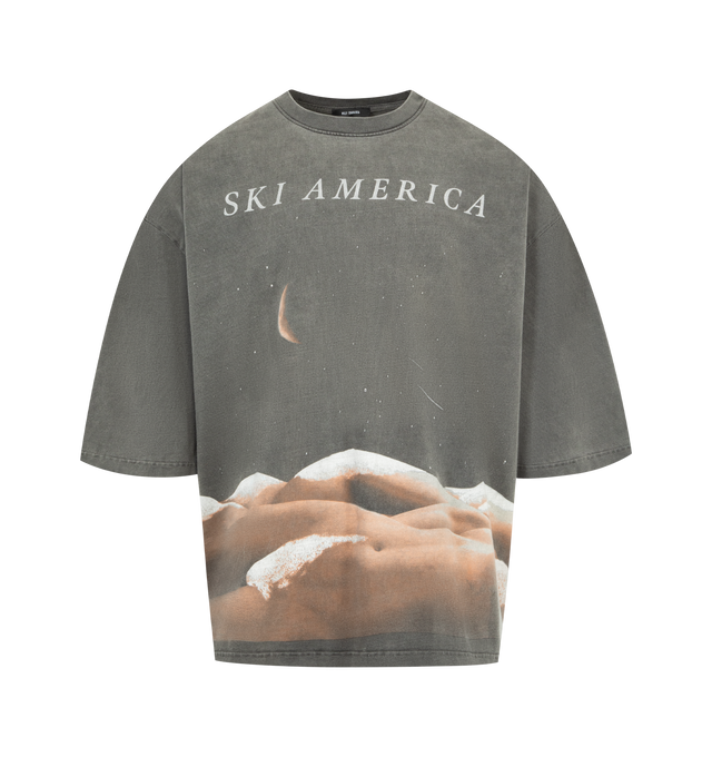 Image 1 of 2 - BLACK - WILLY CHAVARRIA Ski America Tee featuring a medium weight cotton jersey, ribbed crewneck, dropped shoulder seams, lengthy short sleeves, a screen printed graphic at the front and text at the back, distressed details and a faded wash. 100% cotton. Made in USA.