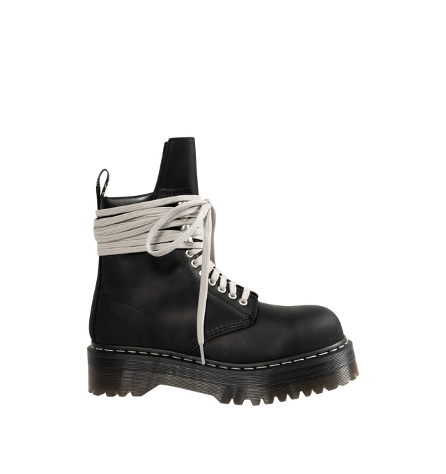 Image 1 of 4 - BLACK - RICK OWENS X DR. MARTENS Steel Toe Quad Platform Boot featuring waxy Republic leather with a padded collar detail, hardened with a steel toe cap, classic eyelets and speed hooks with the exaggerated wraparound laces, easy-access inner ankle zip, extra height Quad sole with pure white welt stitch and a special edition heel loop.