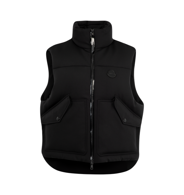 Image 1 of 2 - BLACK - Moncler x EE72 by Edward Enninful Otis Down Vest featuring elastic cotton and nylon blend technical jersey, nylon laqu lining, down-filled, zipper closure, side slits with snap button closure, pockets with snap button closure, hem with drawstring fastening and logo patch. 42% polyamide/nylon, 33% cotton, 25% elastane/spandex. Padding: 90% down, 10% feather. Made in Romania.