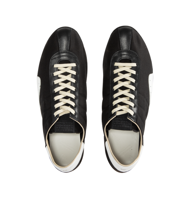 Image 5 of 5 - BLACK - MAISON MARGIELA Sprinters Low-Top Sneakers featuring drill cotton with vintage treatment, stripe down the center of the toe area, cleated rubber sole with numerical logo details, logo label on the tab, white stitching at the back and rubber sole. 54% polyester, 46% cotton. 100% calf leather. Made in Italy.