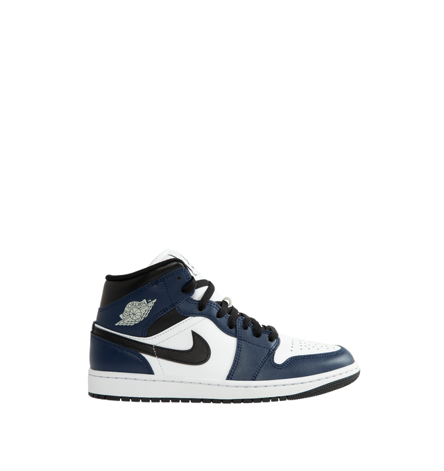 Image 1 of 5 - NAVY - Air Jordan 1 Mid Men's Shoes are crafted with a combination of leather, synthetic leather, and textile materials and feature the iconic mid-top silhouette inspired by the original Air Jordan 1. Designed with Nike Air cushioning, a foam midsole, and a durable rubber outsole with a pivot circle, this classic sneaker delivers lightweight comfort and everyday traction. Signature details include a stitched Swoosh logo, Wings logo at the collar, and Jumpman branding at the tongue. Main Mater